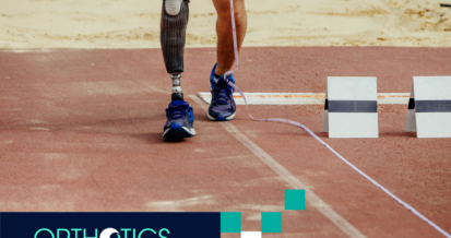 A man with prosthetic leg is running on a playing field