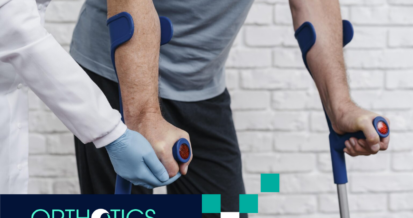 A physical therapist is assisting a patient after amputation