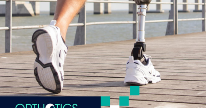 An amputee with prosthetics is running outdoors