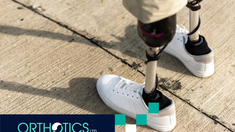 A man with prosthetics walking outdoors