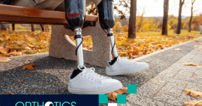 A bilateral amputee wearing prosthetics sitting on a bench in a park