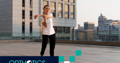 An amputee with a prosthetic leg stretching out