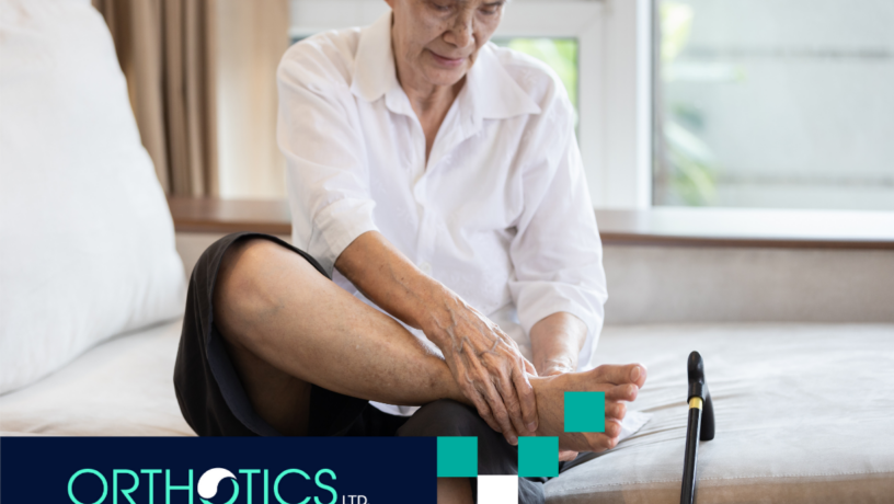 Orthotics for Seniors - featured An elderly person sitting on a bed holding her foot