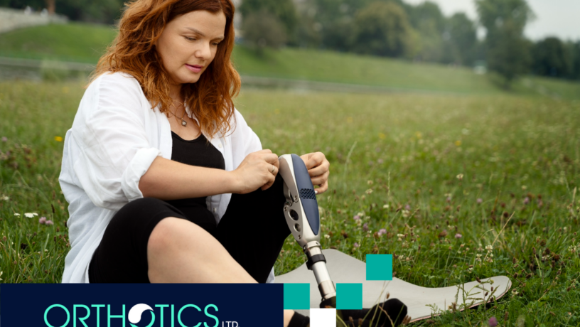 Women in Prosthetics - featured A woman wearing a prosthetic sitting on grass