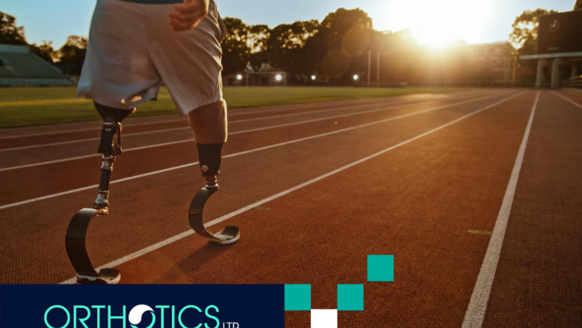 An athlete wearing a prosthetic training in a track