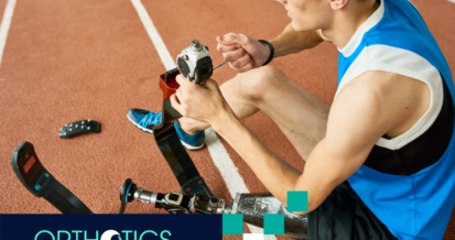 An amputee athlete fixing his prosthetic