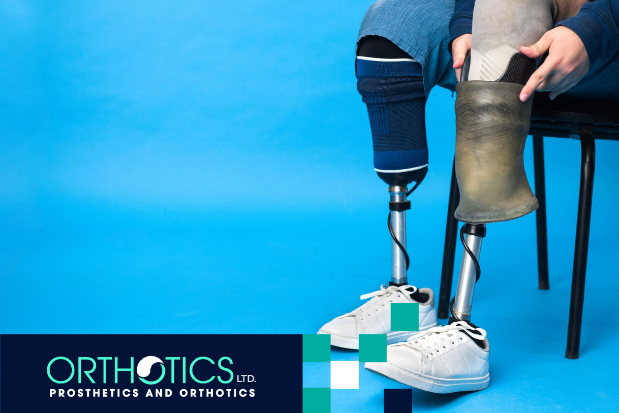 A perosn wearing prosthetics sitting on a chair with a blue background
