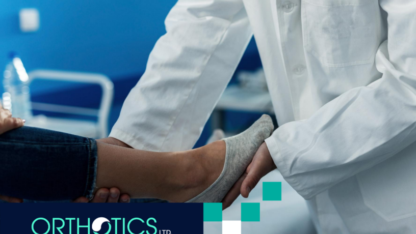 A doctor assisting a patient's foot